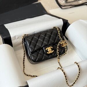Chanel Elegant Black Quilted Mini Bag with Gold Accents
